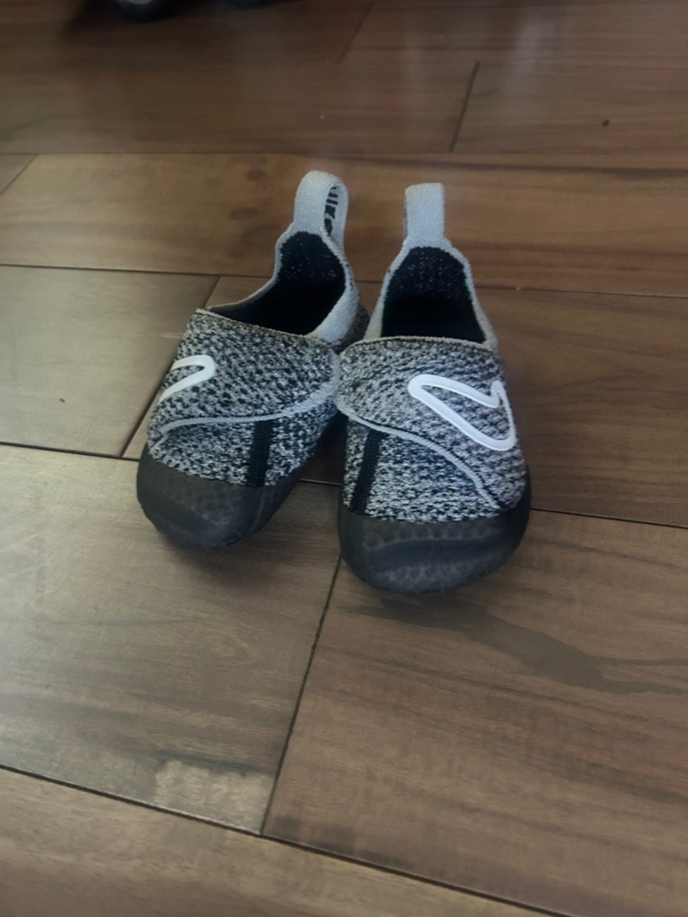 Baby’s Nike walking Slip-On Active Shoes in Black and Gray